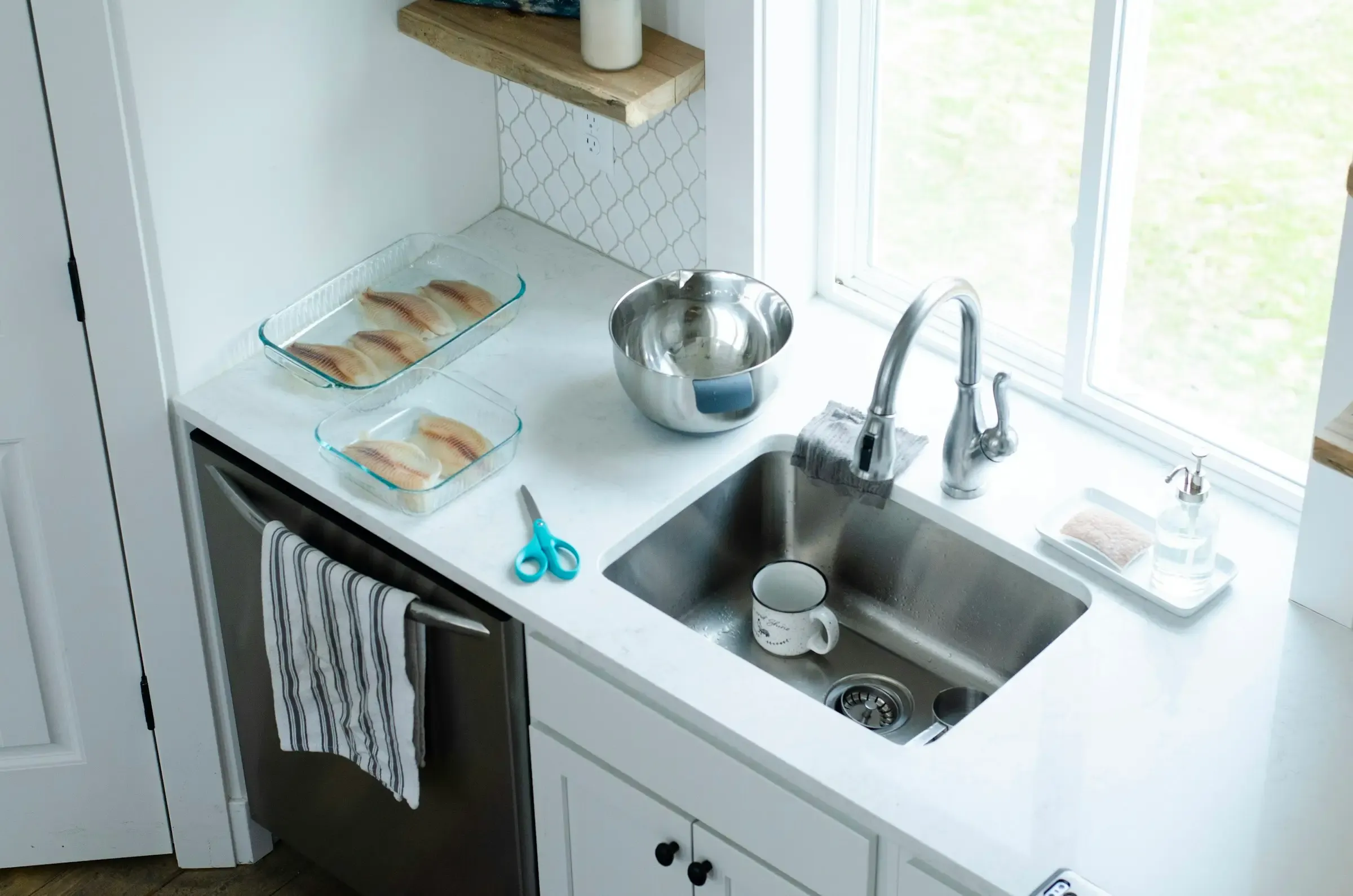 A clean kitchen sink and countertop