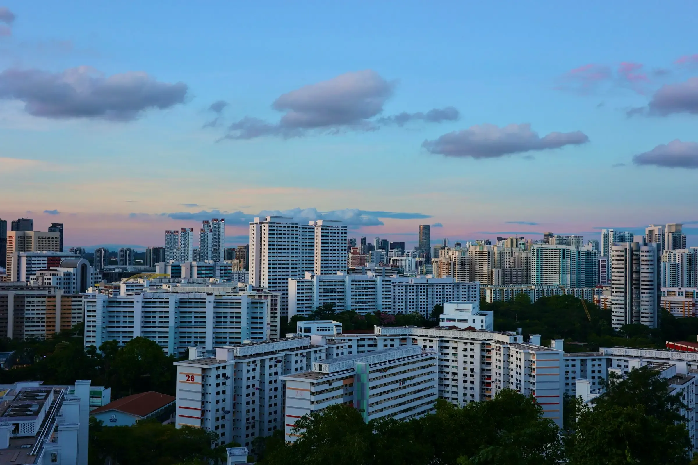 Singapore's skyline and HDB estates at dusk